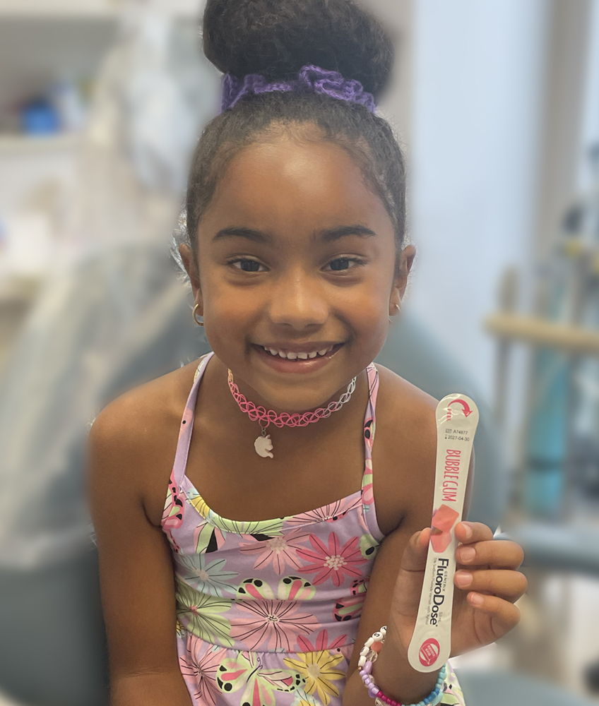 a happy patient with fluoride varnish